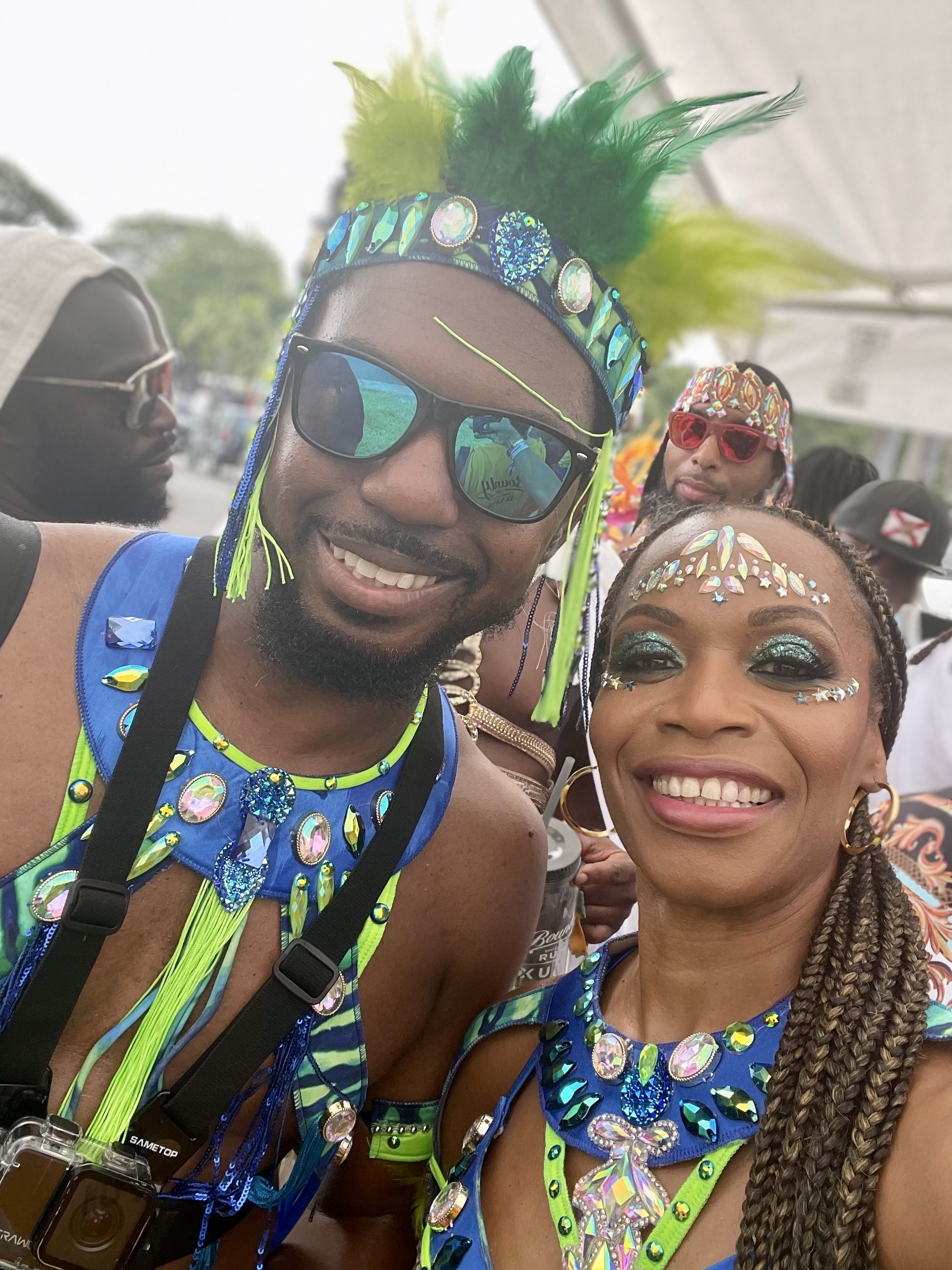 Carnival Summer Escape husband and wife couple posing together in their carnival costumes smiling